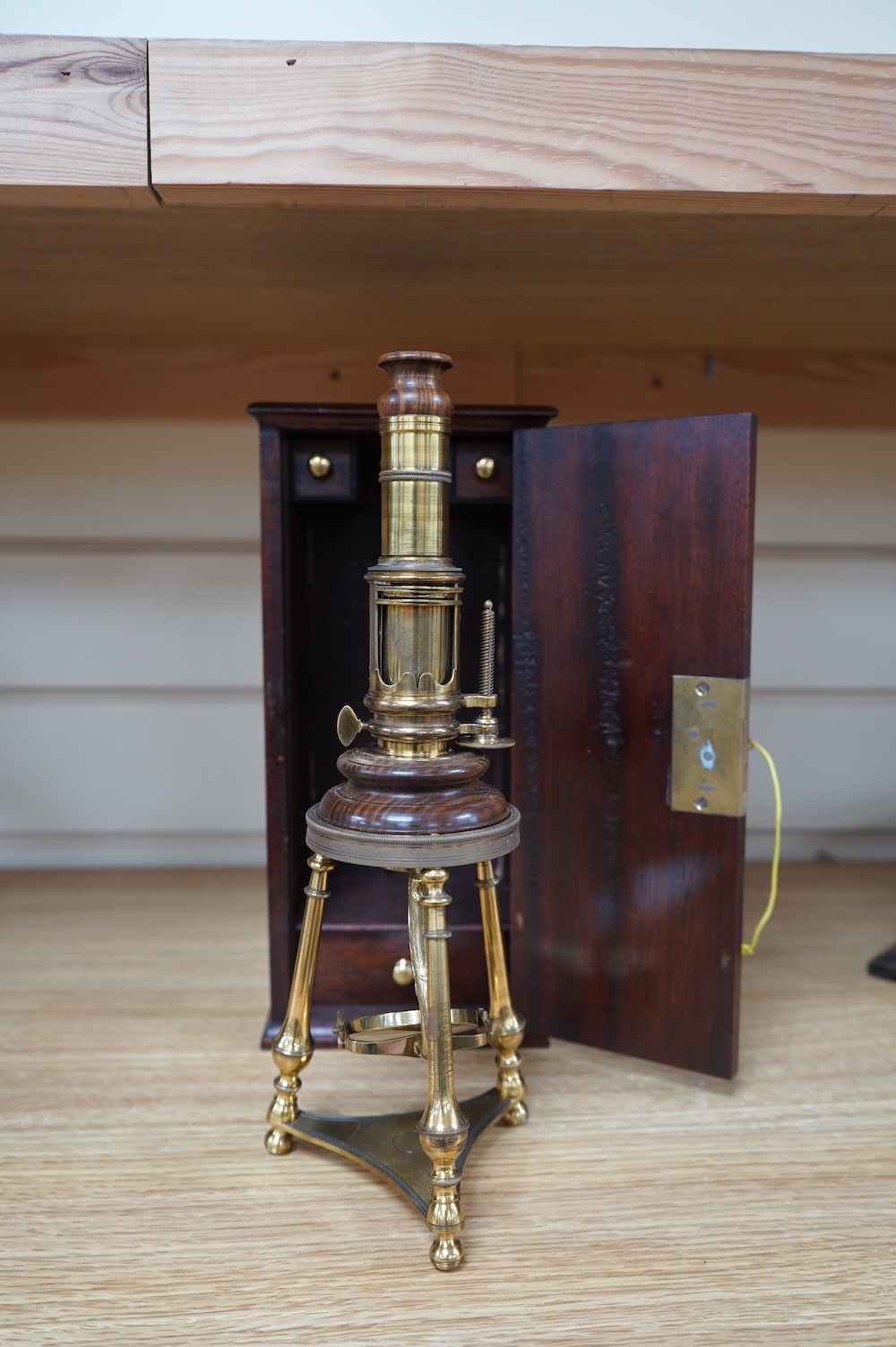 A cased reproduction W.R. Feat 18th century Culpeper style brass microscope, 20cm high, spare lenses in drawer of case. Condition - good.